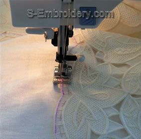 Stitch the lace to the fabric