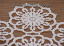Freestanding lace doily or table runner close-up image