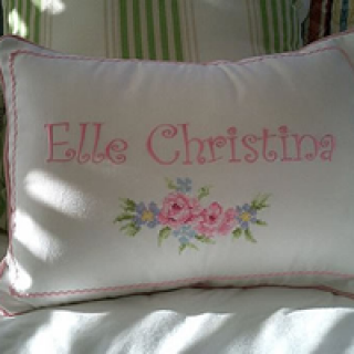 Pillow case with cross stitch rose embroidery