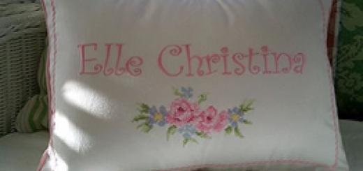 Pillow case with cross stitch rose embroidery
